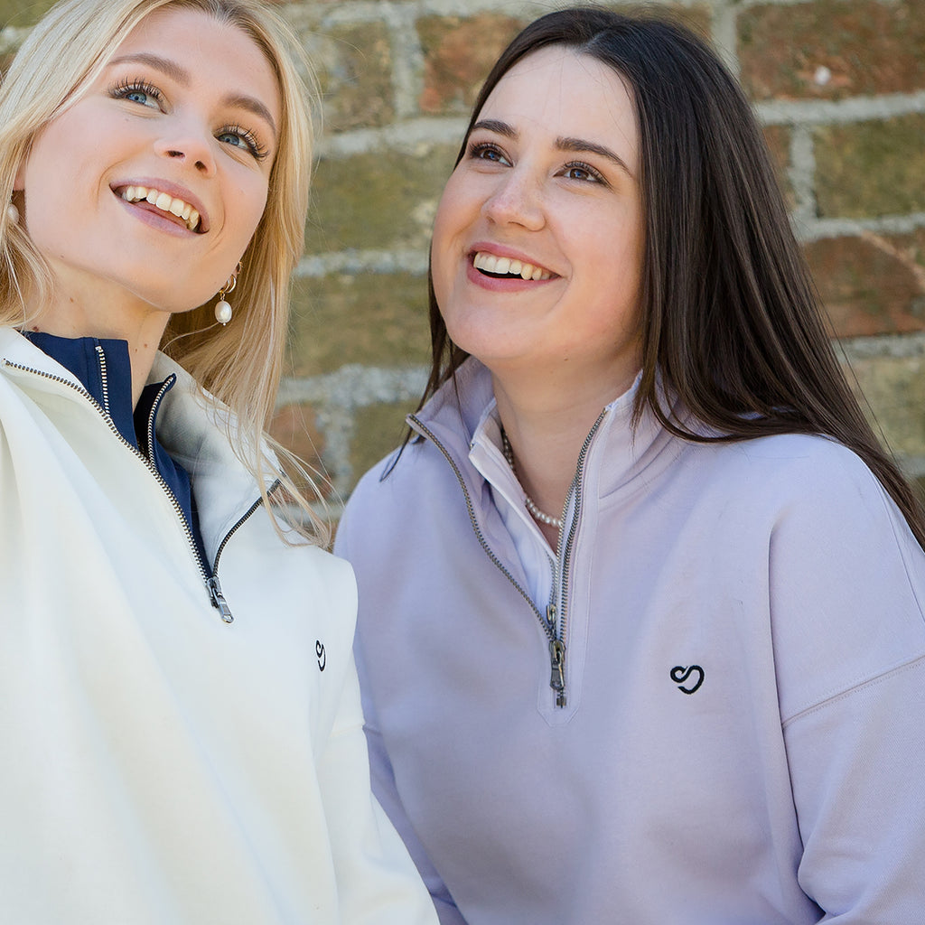 Girls smiling wearing Mochara jumpers